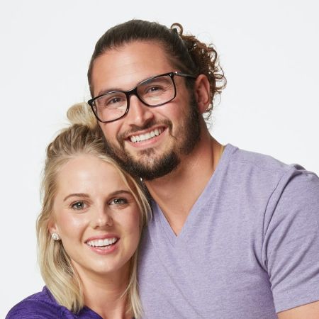 Nicole Franzel and Victor Arroyo pose for a picture.